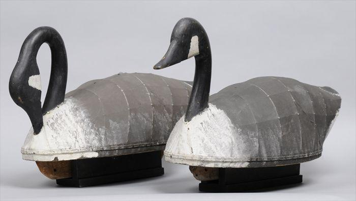 PAIR OF WOOD AND CANVAS COVERED GEESE Together with two