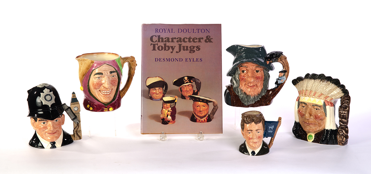 FIVE ROYAL DOULTON CHARACTER JUGS AND THE CHARACTER JUG BOOK