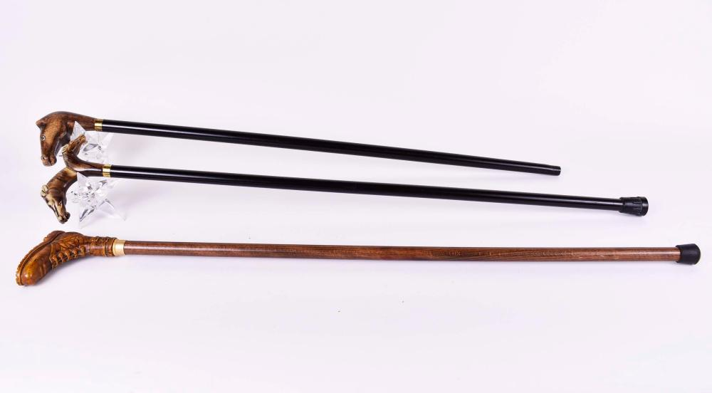 THREE ITALIAN WALKING STICKSModern Two with horse head handles one