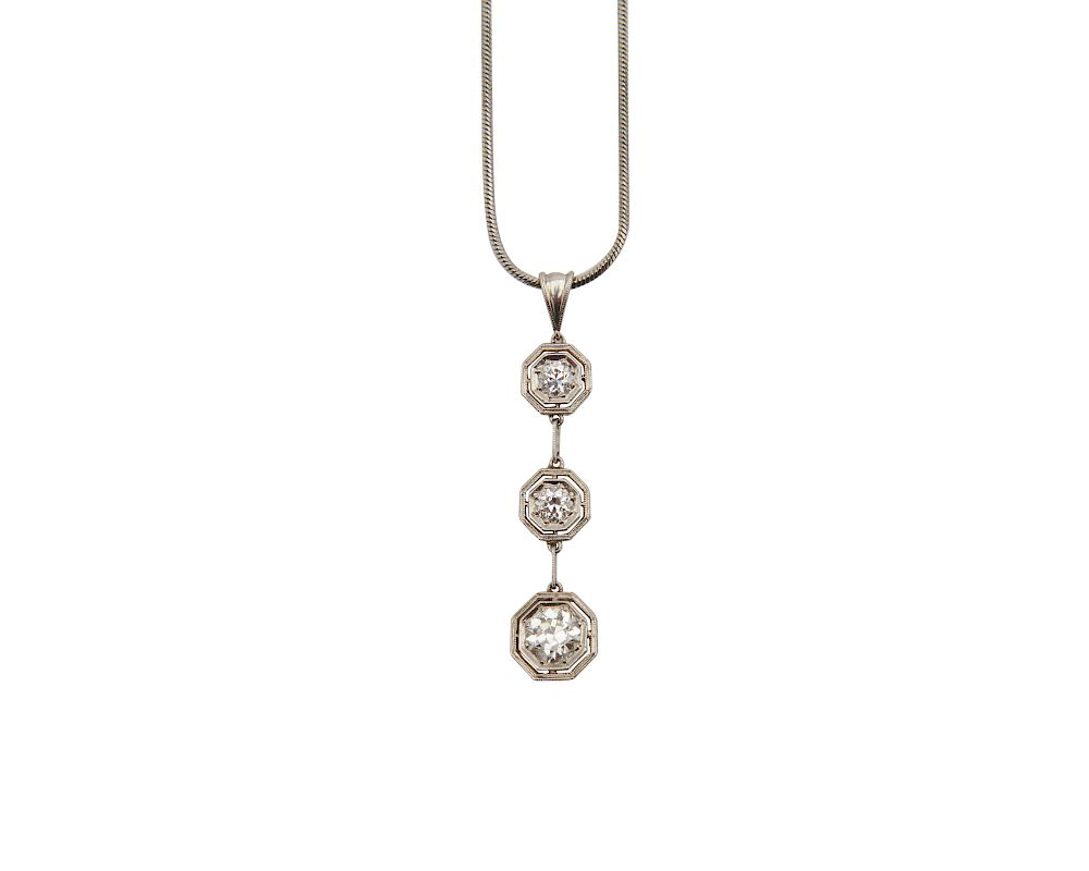 Platinum and Diamond Pendant Platinum and Diamond Pendant suspending three