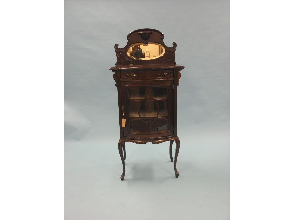 A late Victorian dark mahogany display cabinet raised scroll shape