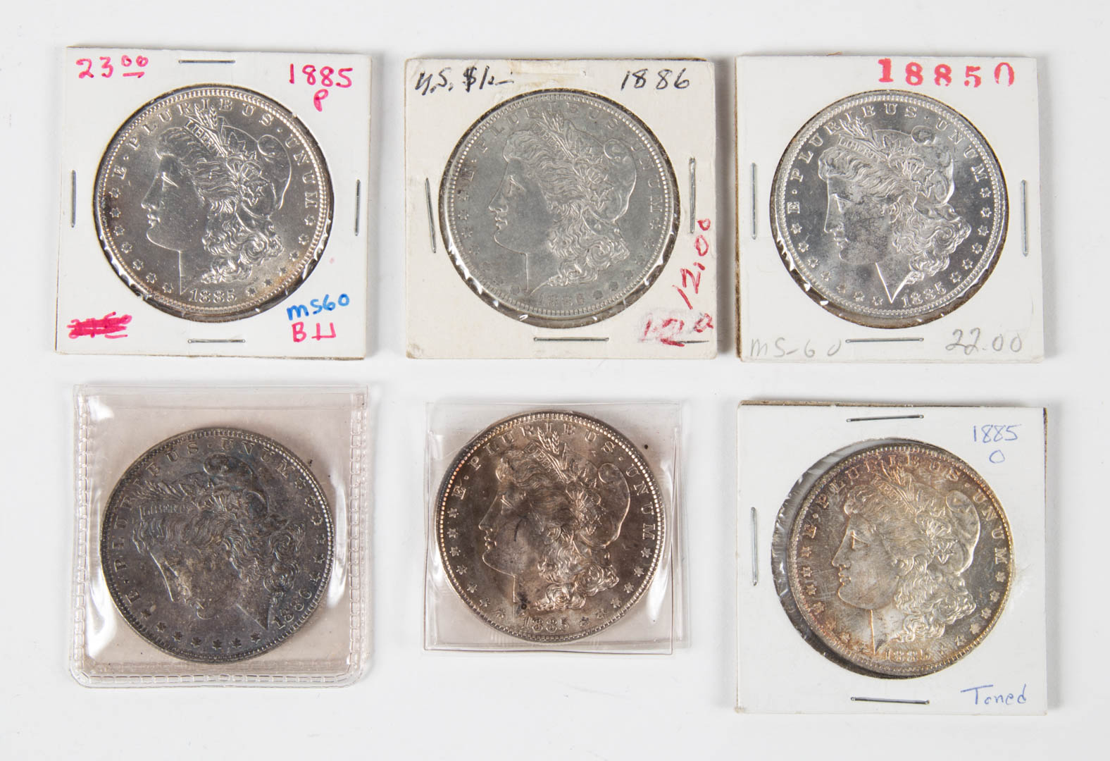 USA Morgan Dollars Six Morgan Dollars two 1885 MS62 MS63
