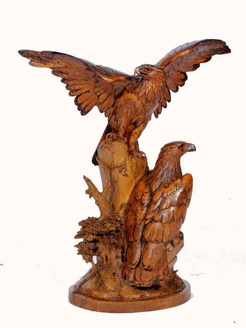 A SWISS BLACK FOREST CARVING in the form of two