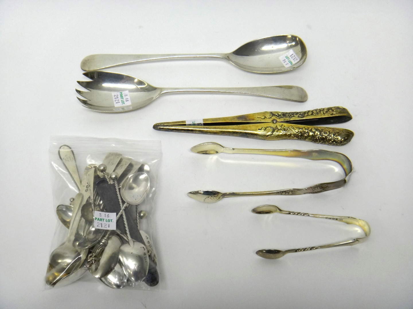 A group of silver wares comprising a pair of silver