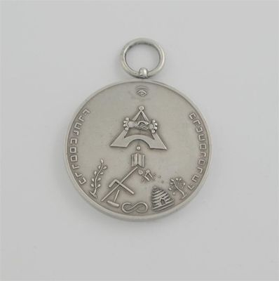 A 19th century Fraternity badge jewel circular with a pendant