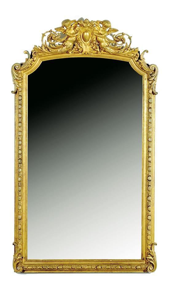 Continental carved giltwood mirror mid 19th century cartouche flanked by