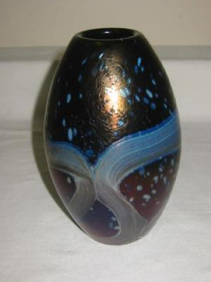 A MDINA GLASS VASE of ovoid form with swirling lustre