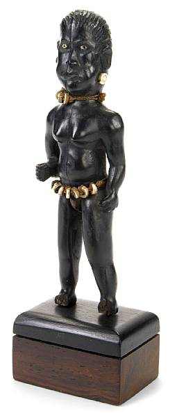 A Solomon Islands female figure with inlaid shell eyes and