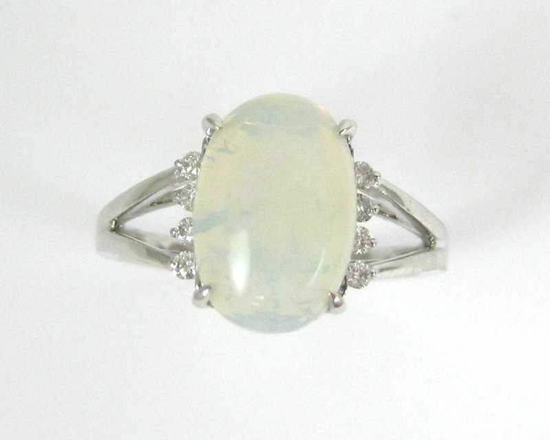 OPAL DIAMOND AND FOURTEEN KARAT GOLD RING The white gold