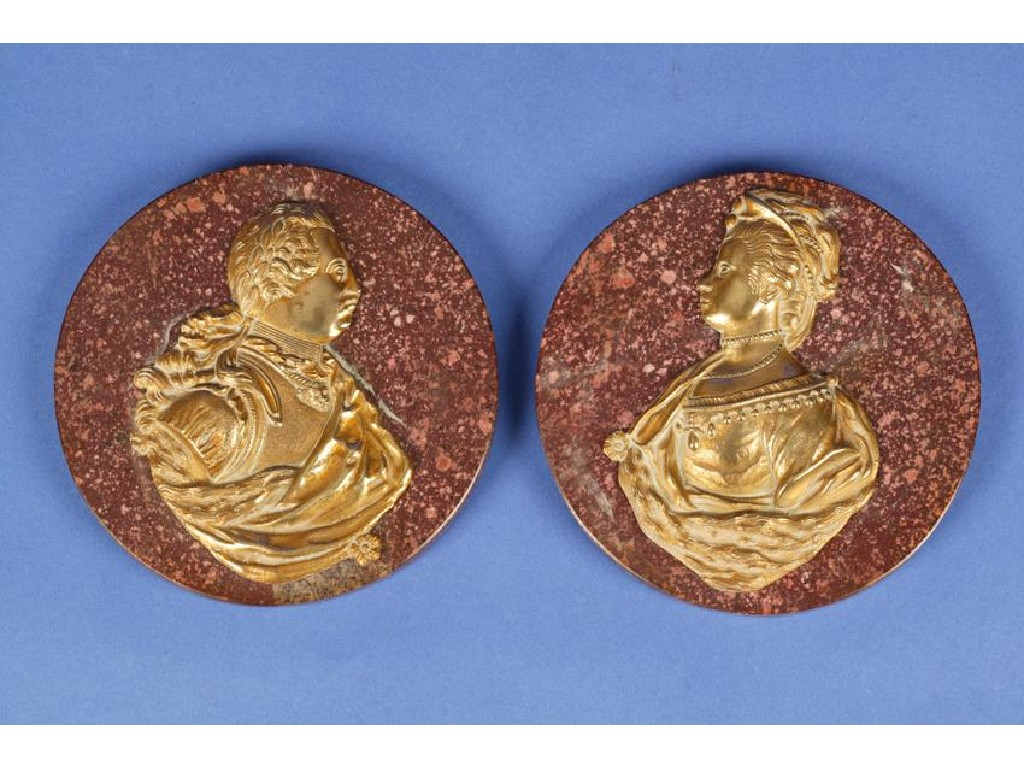 A PAIR OF GEORGE III GILT METAL PORTRAIT PLAQUES of
