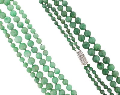 A two row graduated jade bead necklace The beads graduated