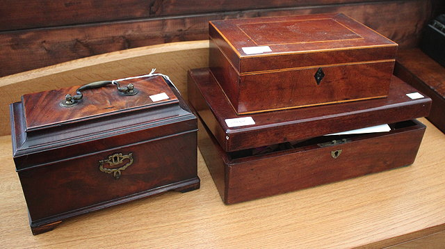 A GEORGE III MAHOGANY TEA CADDY with three divisions and