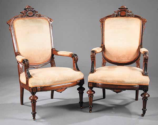 A Pair of Victorian Walnut and Ebonized Chairs in the