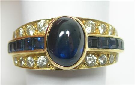 An 18ct gold mounted sapphire and diamond set ring designed