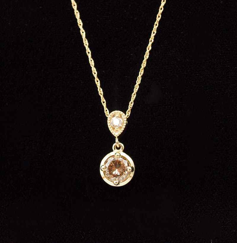 CHOCOLATE DIAMOND PENDANT 14K yellow gold pendant necklace contains one