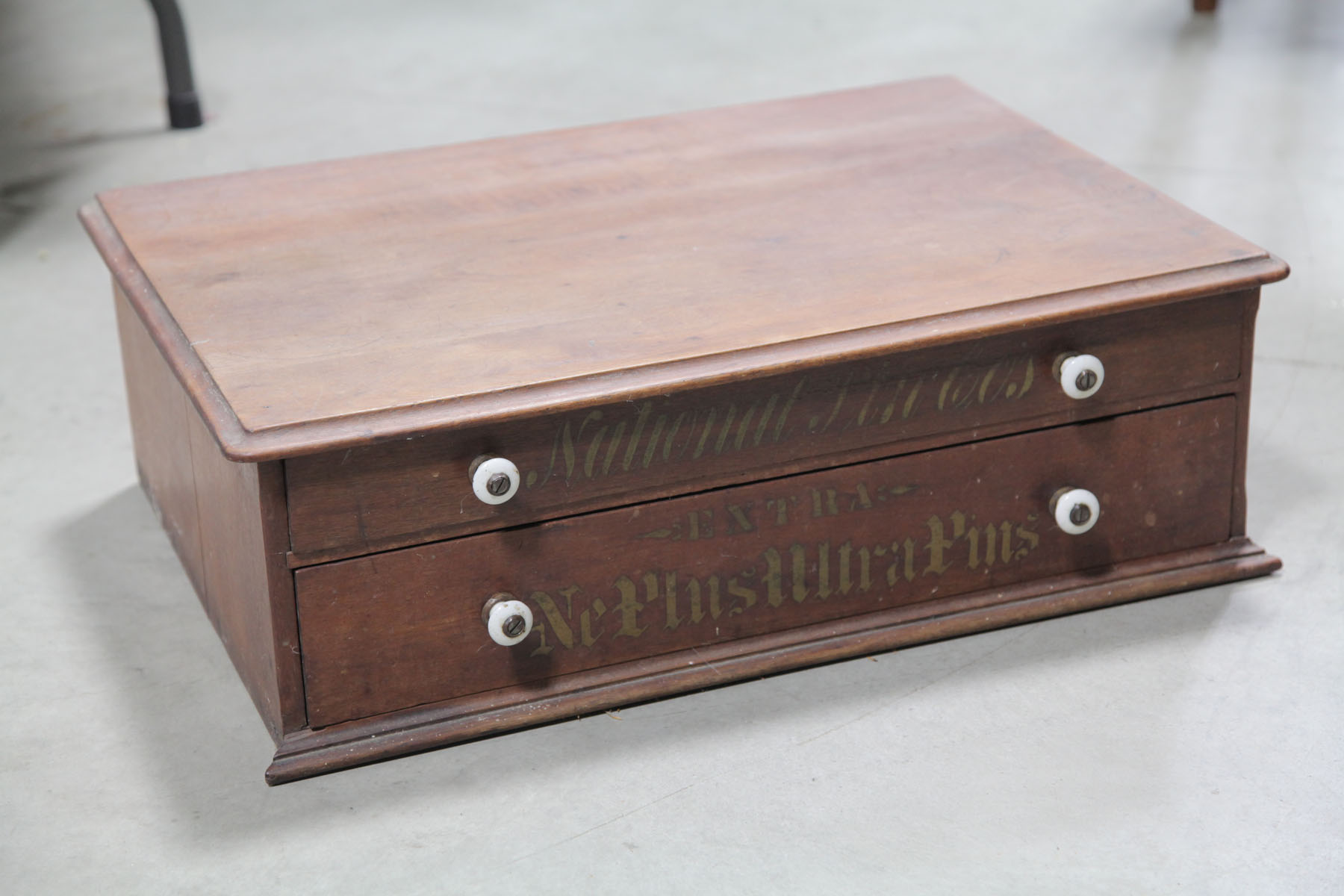SPOOL CABINET American early 20th century Two drawer walnut spool