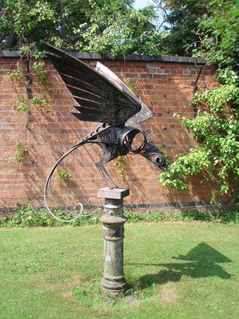 WALENTY PYTEL A large sculpture of Winged Bird with scrolling