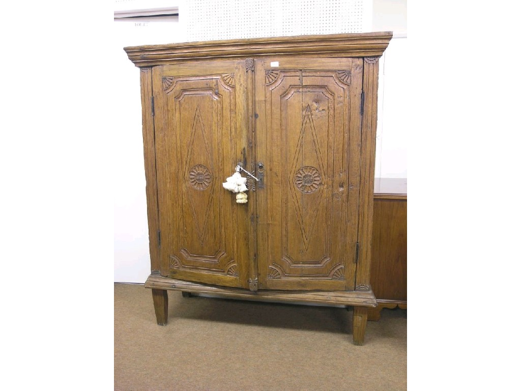 An imported hardwood armoire in 18th century style pair of