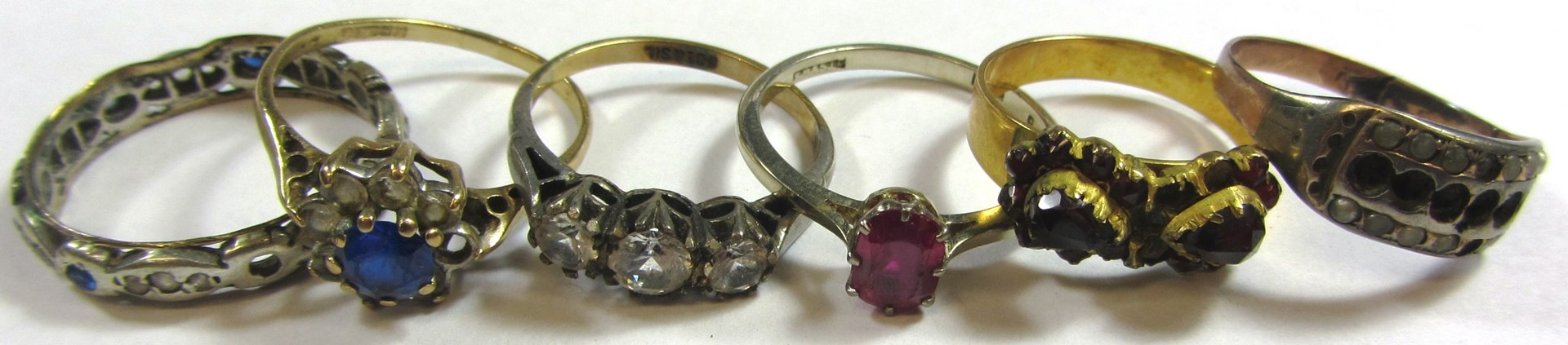A white gold ring claw set with a cushion shaped