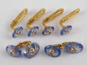 Cartier An 18 carat gold sapphire and diamond dress set