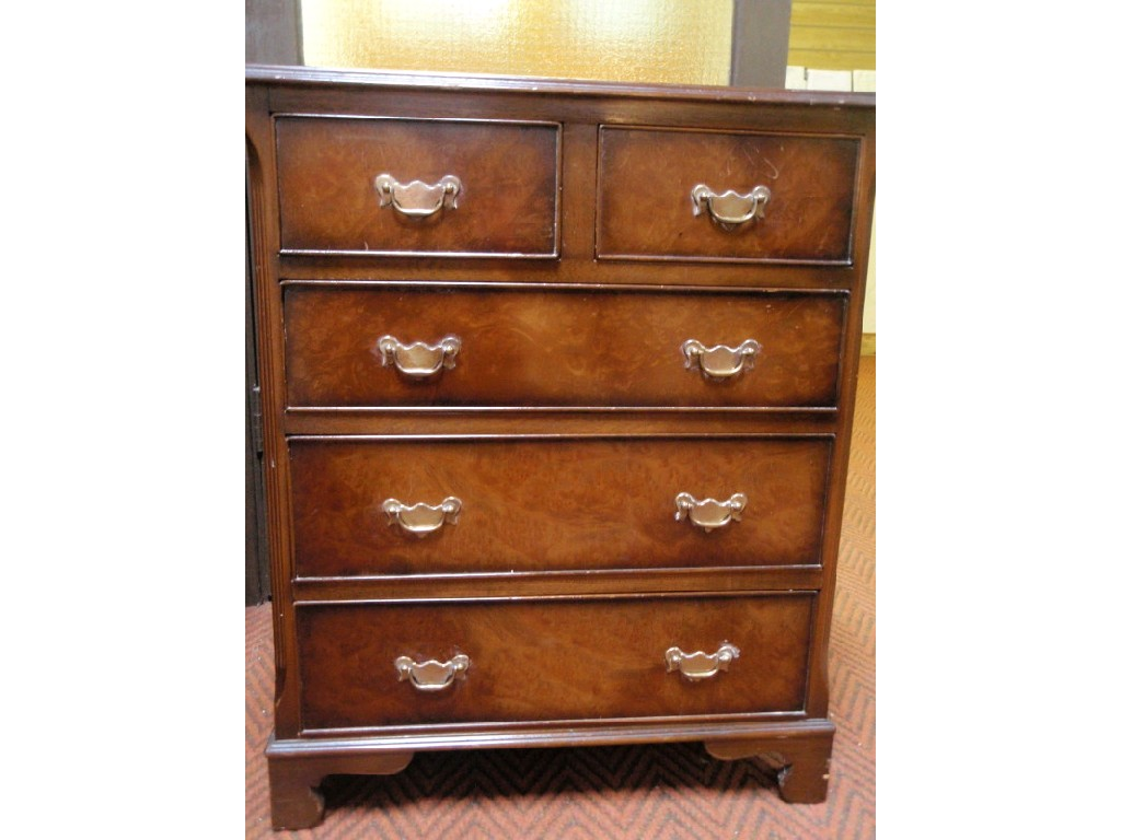 A Georgian style figured walnut chest of two short and