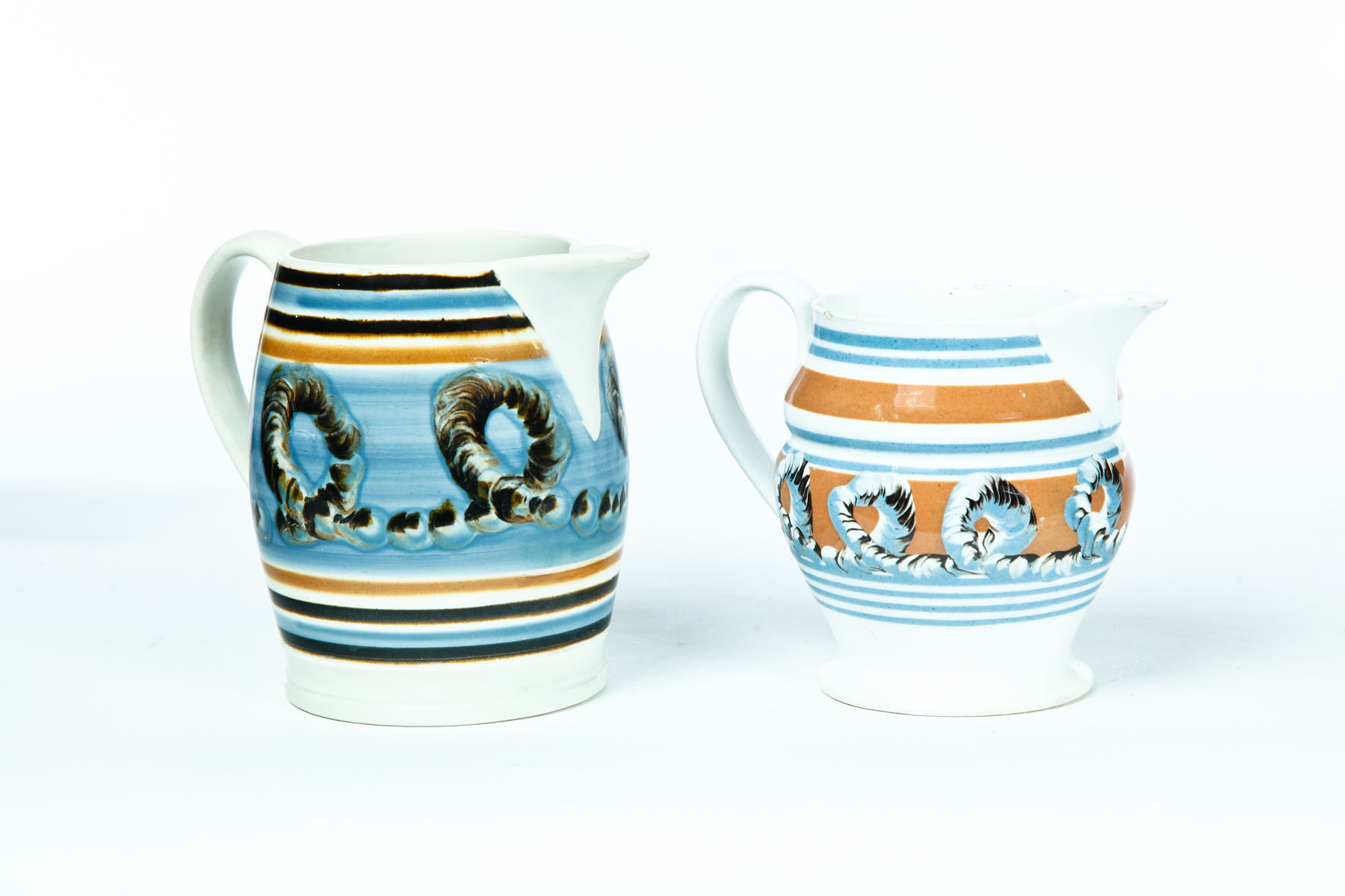 TWO SMALL MOCHA PITCHERS England 2nd quarter 19th century Leaf
