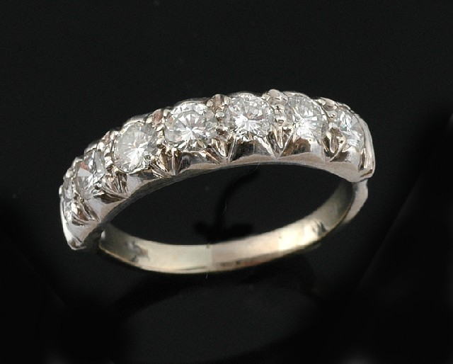 A diamond eternity ring The seven round brilliant cut diamonds