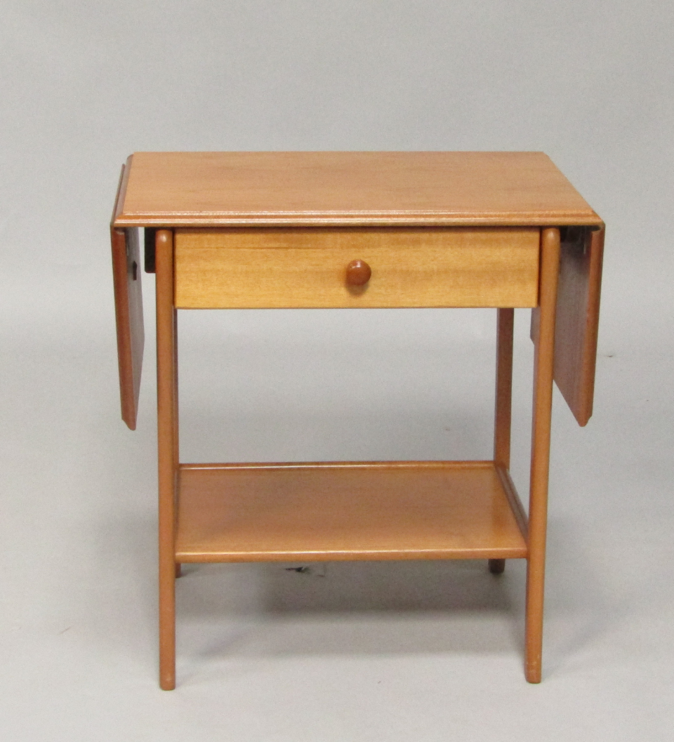A 1960 s blonde teak drop leaf occasional table with