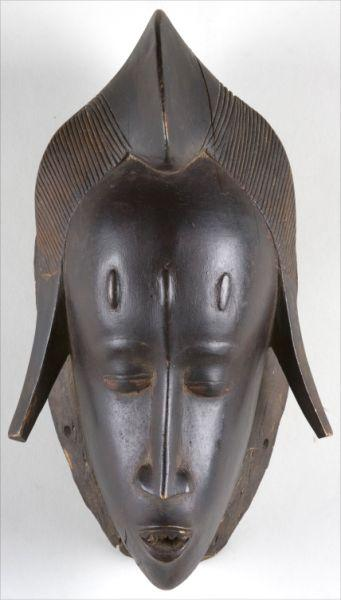 Carved Wooden African Mask 20th century depicts a young woman