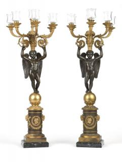 A pair of Empire style gilt patinated bronze candelabra 19th