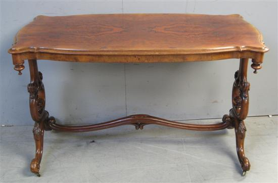 19th Century walnut centre table with shaped top on twin