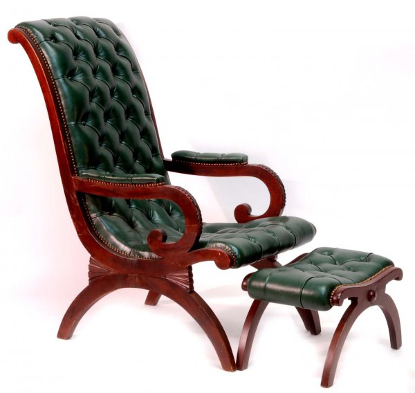 Chair and ottoman Carved frame Tufted green leather upholstery Fruitwood