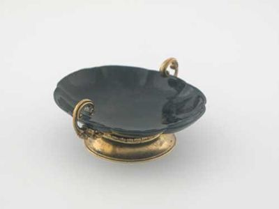 A continental silvergilt mounted small stone dish with two upswept