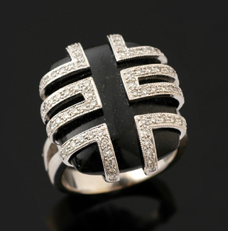 An onyx and diamond plaque ring The cushion shaped onyx