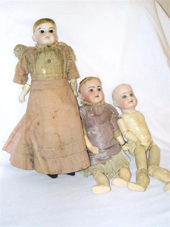 Thee German bisque dolls a 13 open mouth brown eyed