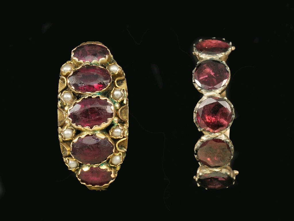 A Victorian Ruby and Seed Pearl Ring rub over set