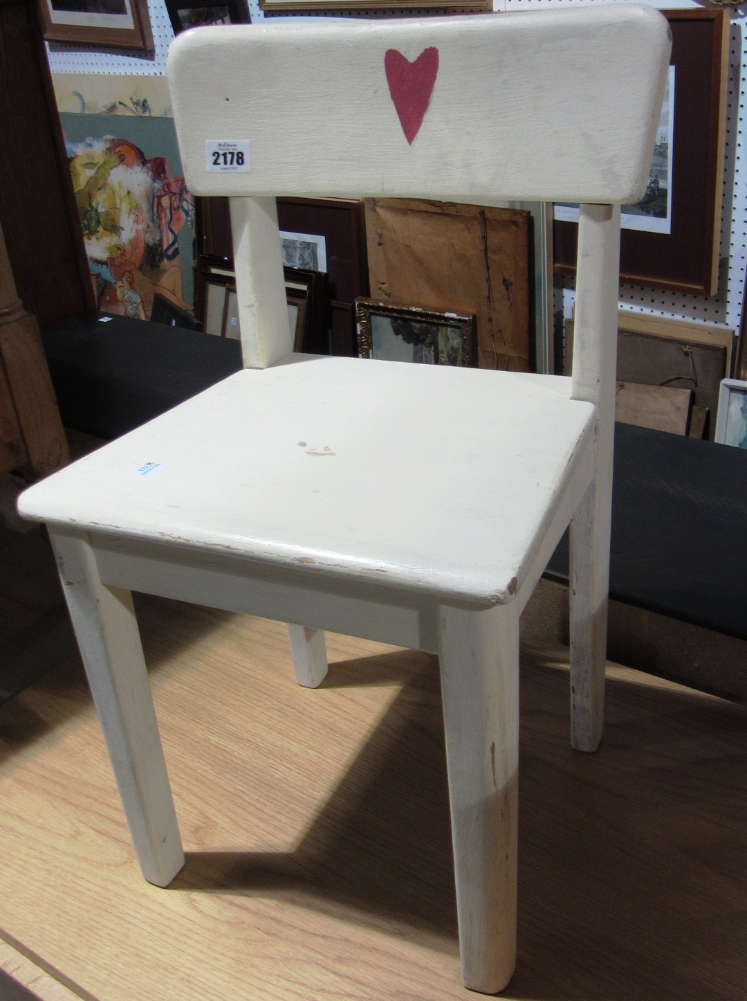 A 20th century cream painted duet stool and a similar