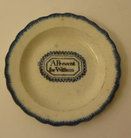 A PEARLWARE NURSERY PLATE c 1820 of lobed circular form