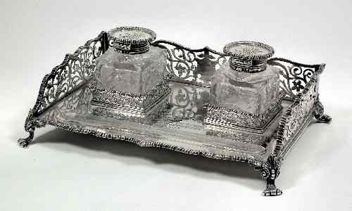 A late Victorian silver rectangular two division inkstand with gadrooned