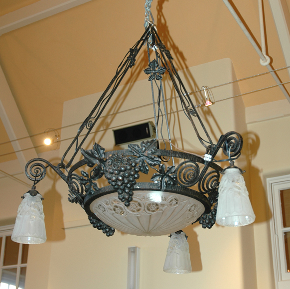 A DEGUE ART DECO WROUGHT IRON AND GLASS CEILING LIGHT