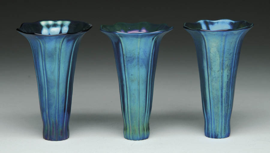 THREE CONTEMPORARY LILY SHADES Vertically ribbed blue lily shades are