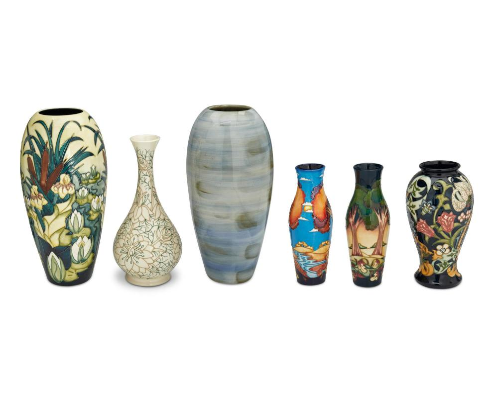 A GROUP OF MOORCROFT POTTERY VASESA group of Moorcroft pottery