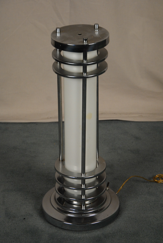 A Cylindrical Chrome Table Lamp horizontal bars stepped round base