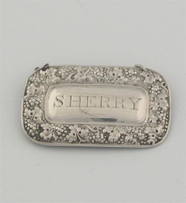 A George IV wine label rounded oblong with fruiting vine