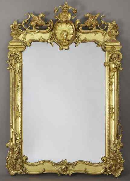 French carved gilt framed wall mirror the crest centered by