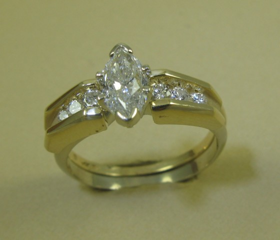 DIAMOND AND FOURTEEN KARAT GOLD WEDDING SET the engagement ring