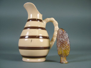 A small amber glass bottle moulded as a nut 7