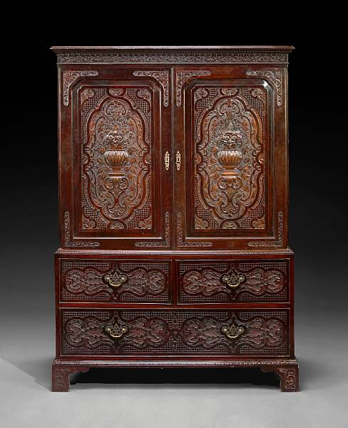 A George II carved mahogany linen press stamped Edwards and