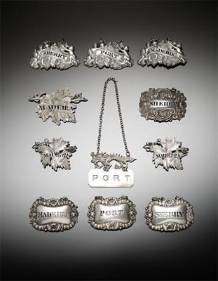 A Victorian silver wine label maker s mark lost in