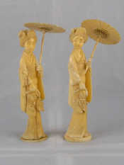 Two Japanese ivory figures each a lady with parasol circa